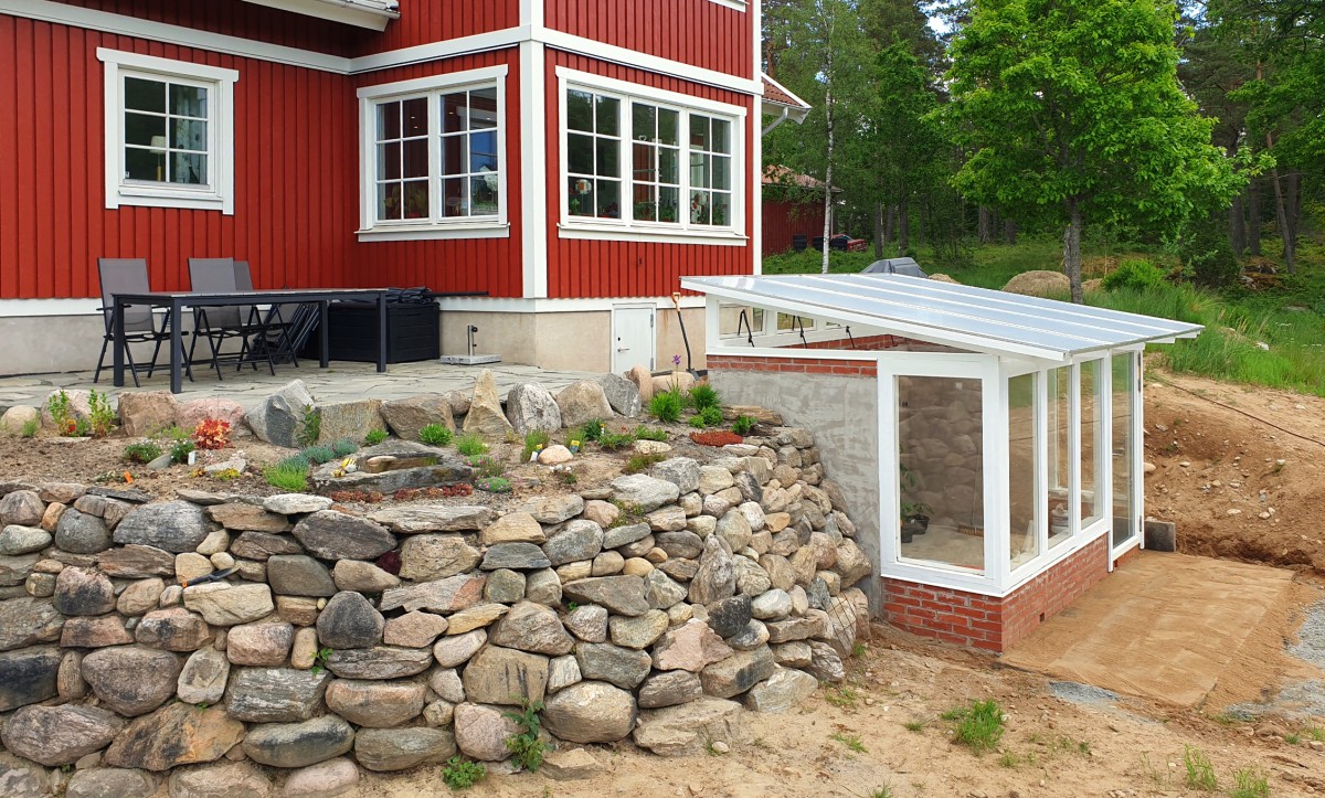 Greenhouse in unique design with owner-cut lumber